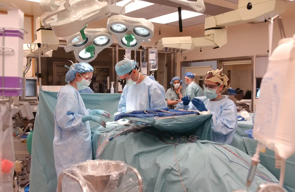 Surgeons working on a patient in a hospital theatre